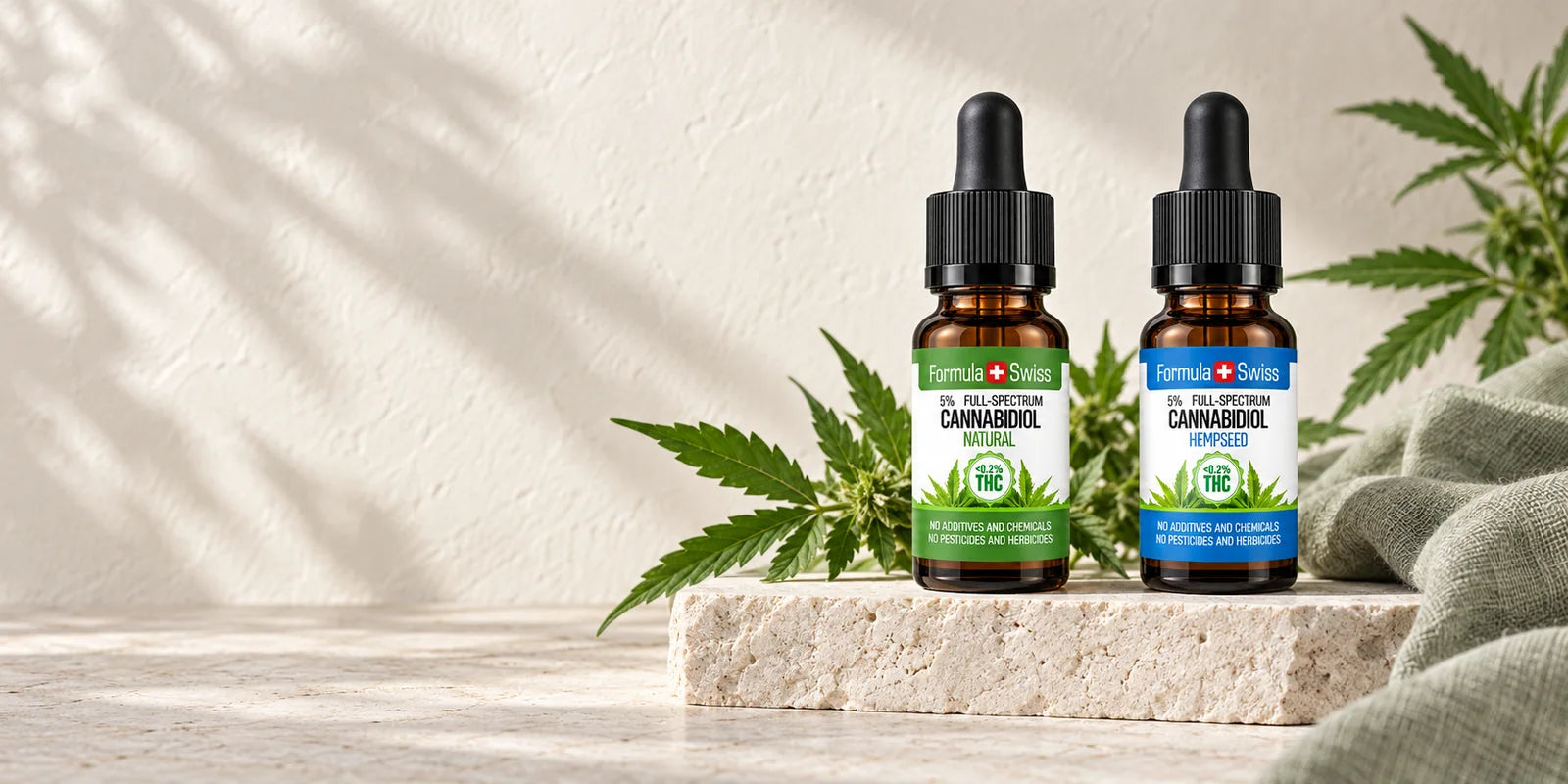Formula Swiss CBD oil bottles on pale stone